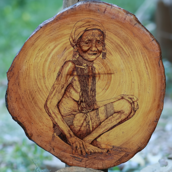 Wood Burning Artwork – A Typical Garo Woman in Everyday Life