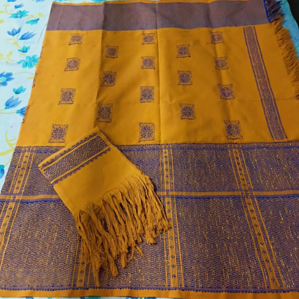 Mustard Yellow Dakmanda with Royal Blue Traditional Motifs and Border Mustard Yellow Reshmi Dakmanda with Royal Blue Traditional Motifs & Border| Handwoven Loin Loom Traditional Wraparound with Chuni
